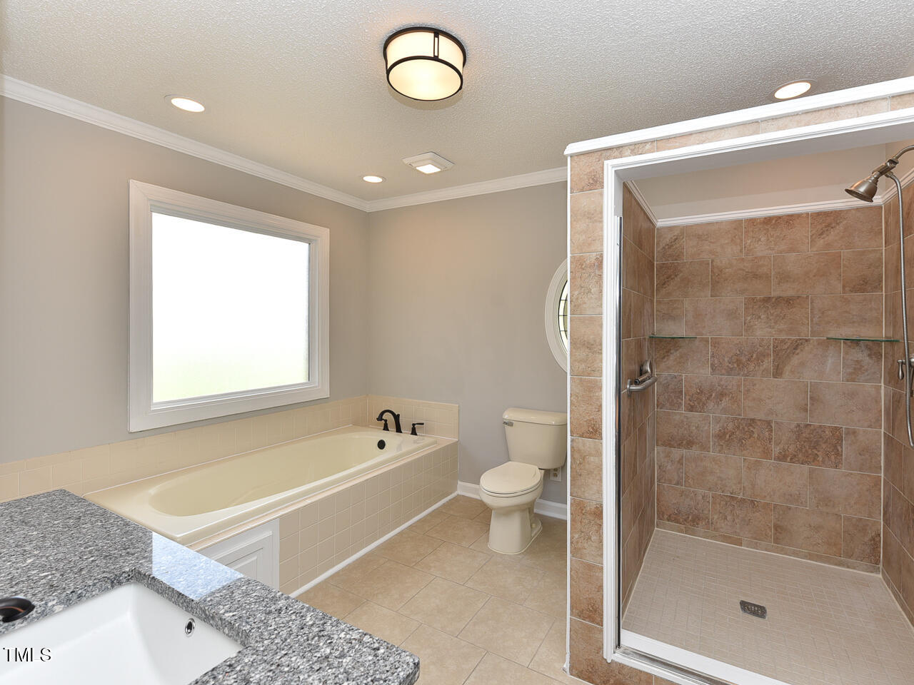 232 Mitchell Farm Road Goldsboro, NC 27530 - Photo 36 of 82 a bathroom with a bathtub and a shower