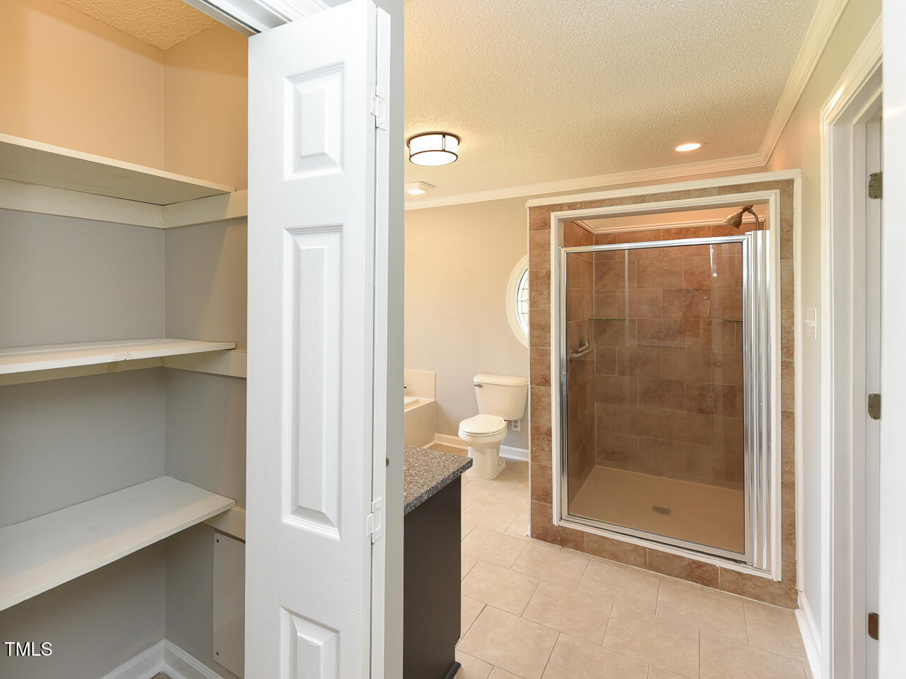 232 Mitchell Farm Road Goldsboro, NC 27530 - Photo 39 of 82 a bathroom with a glass shower door