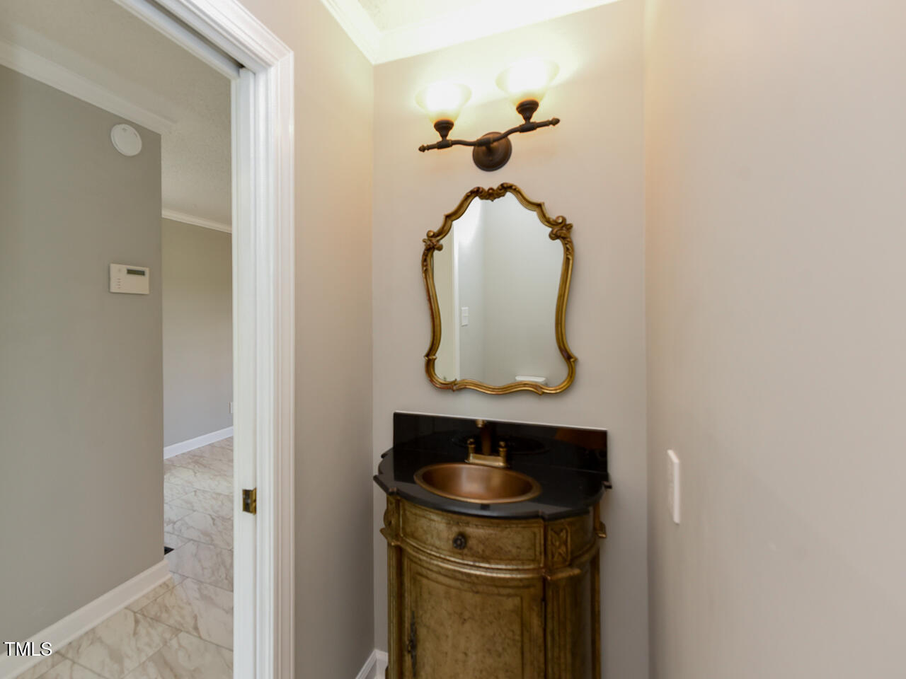 232 Mitchell Farm Road Goldsboro, NC 27530 - Photo 40 of 82 a bathroom with a sink and a mirror