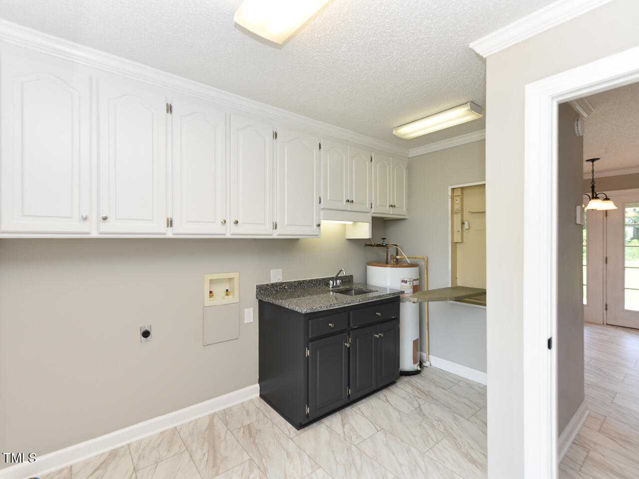 232 Mitchell Farm Road Goldsboro, NC 27530 - Photo 45 of 82 a kitchen with a sink and cabinets