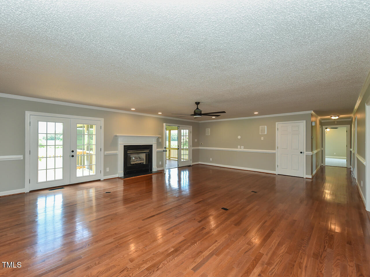 232 Mitchell Farm Road Goldsboro, NC 27530 - Photo 46 of 82 wooden floor in an empty room with a fireplace