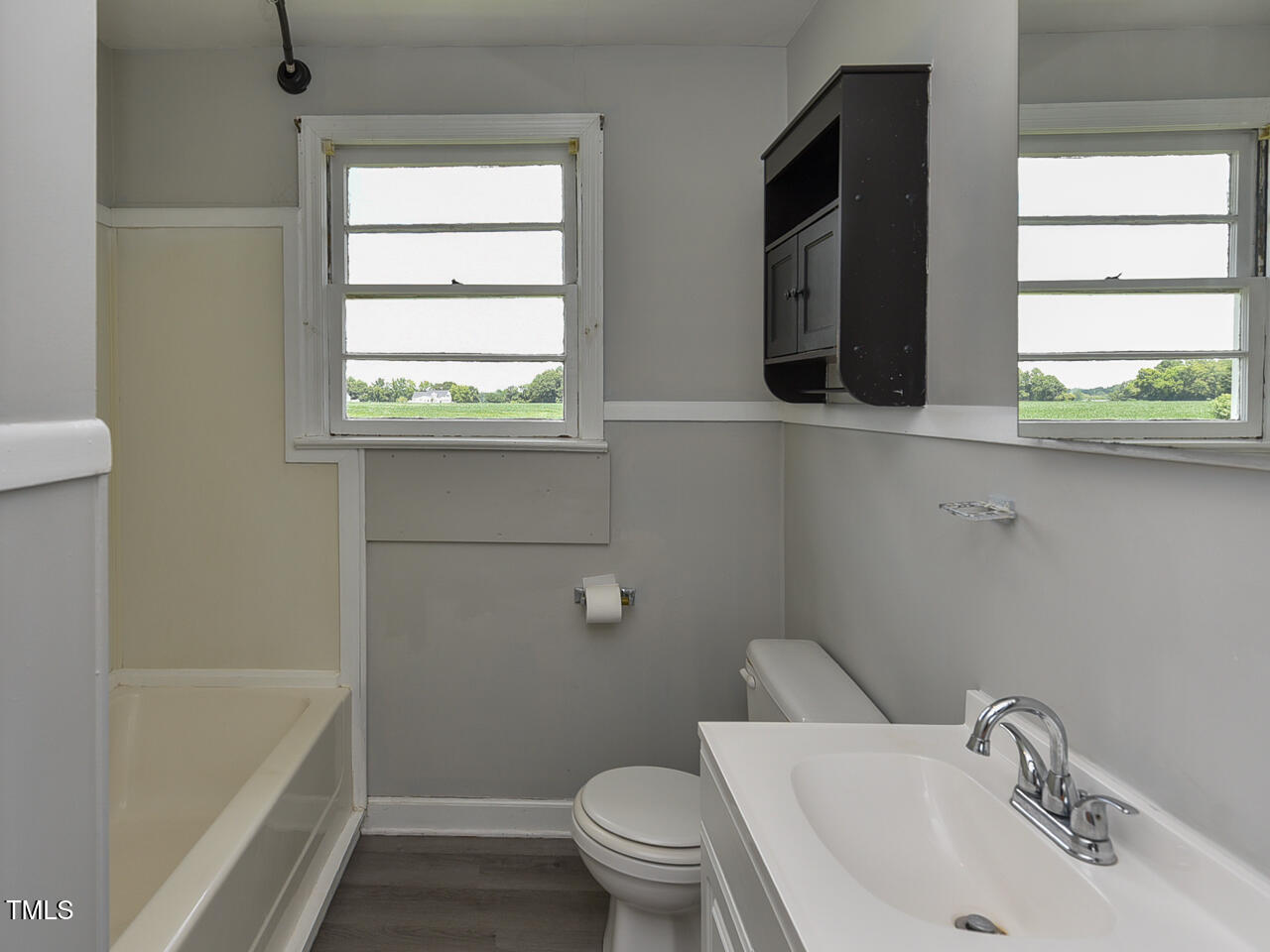 232 Mitchell Farm Road Goldsboro, NC 27530 - Photo 63 of 82 a bathroom with a sink a toilet and a bathtub
