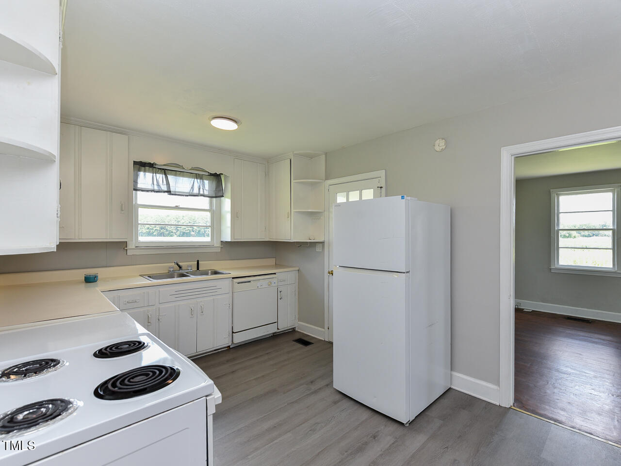 232 Mitchell Farm Road Goldsboro, NC 27530 - Photo 67 of 82 a kitchen with a refrigerator a sink and cabinets