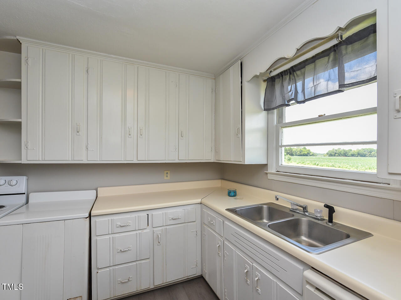 232 Mitchell Farm Road Goldsboro, NC 27530 - Photo 68 of 82 a kitchen with sink cabinets and window