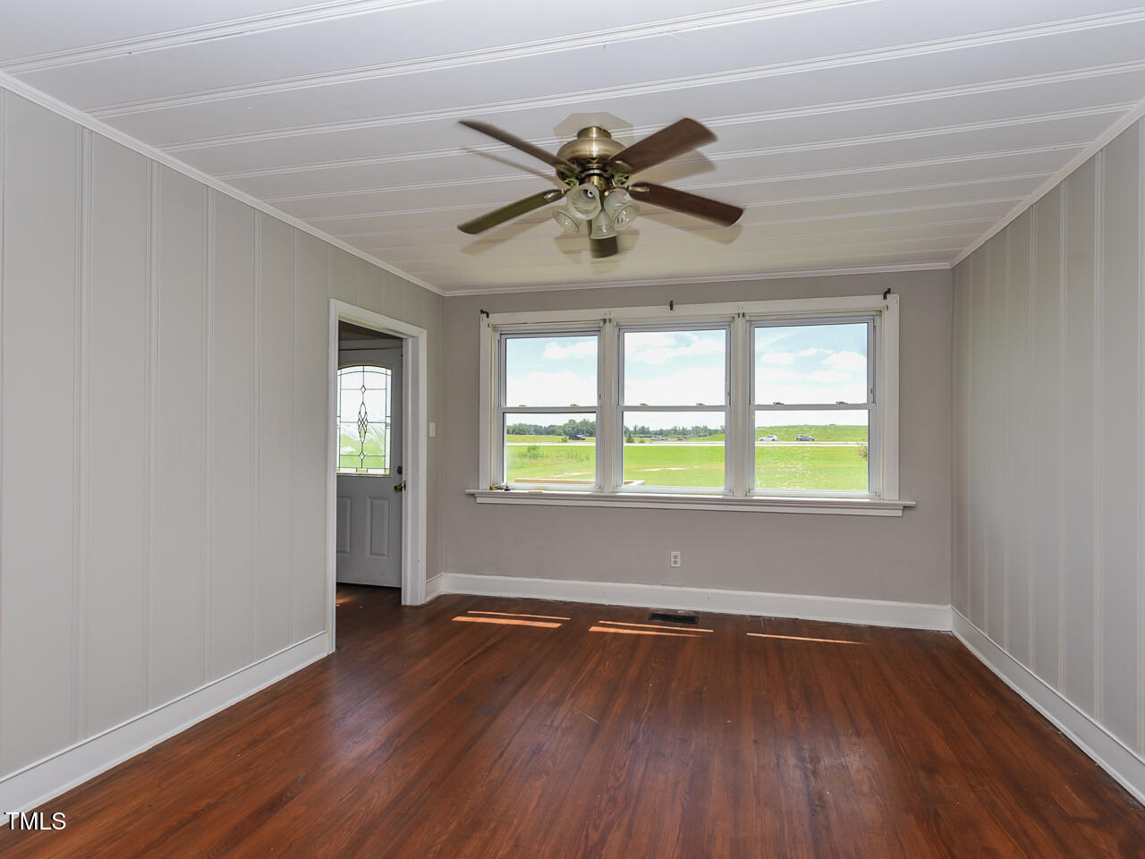 232 Mitchell Farm Road Goldsboro, NC 27530 - Photo 72 of 82 a view of empty room with wooden floor and fan