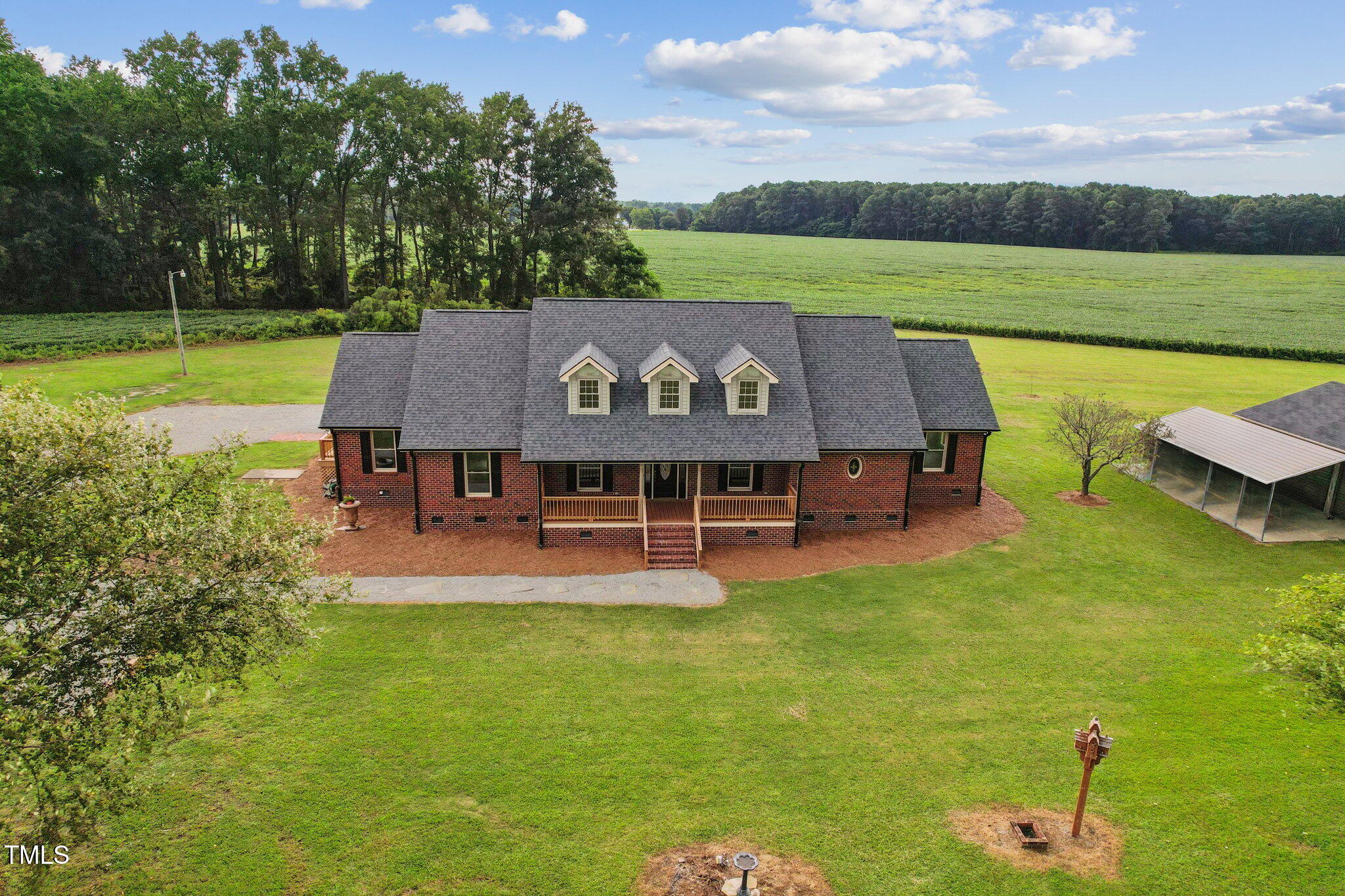 232 Mitchell Farm Road Goldsboro, NC 27530 - Photo 81 of 82 a view of a swimming pool with lawn chairs and a big yard