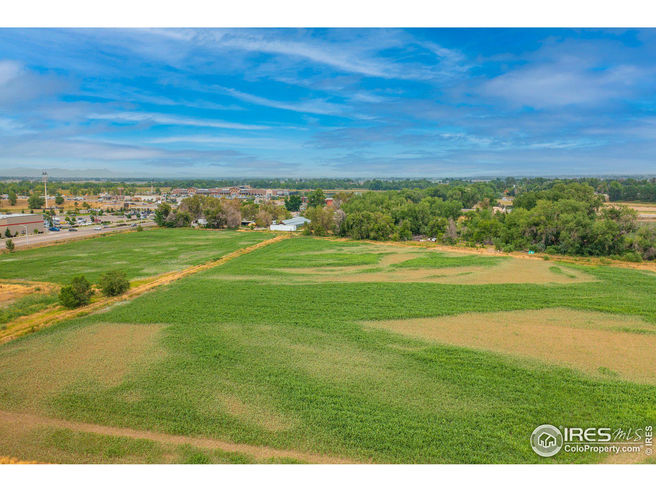 4801 East Harmony Road Fort Collins, CO 80528 - Photo 20 of 27 a view of a big room with a big yard