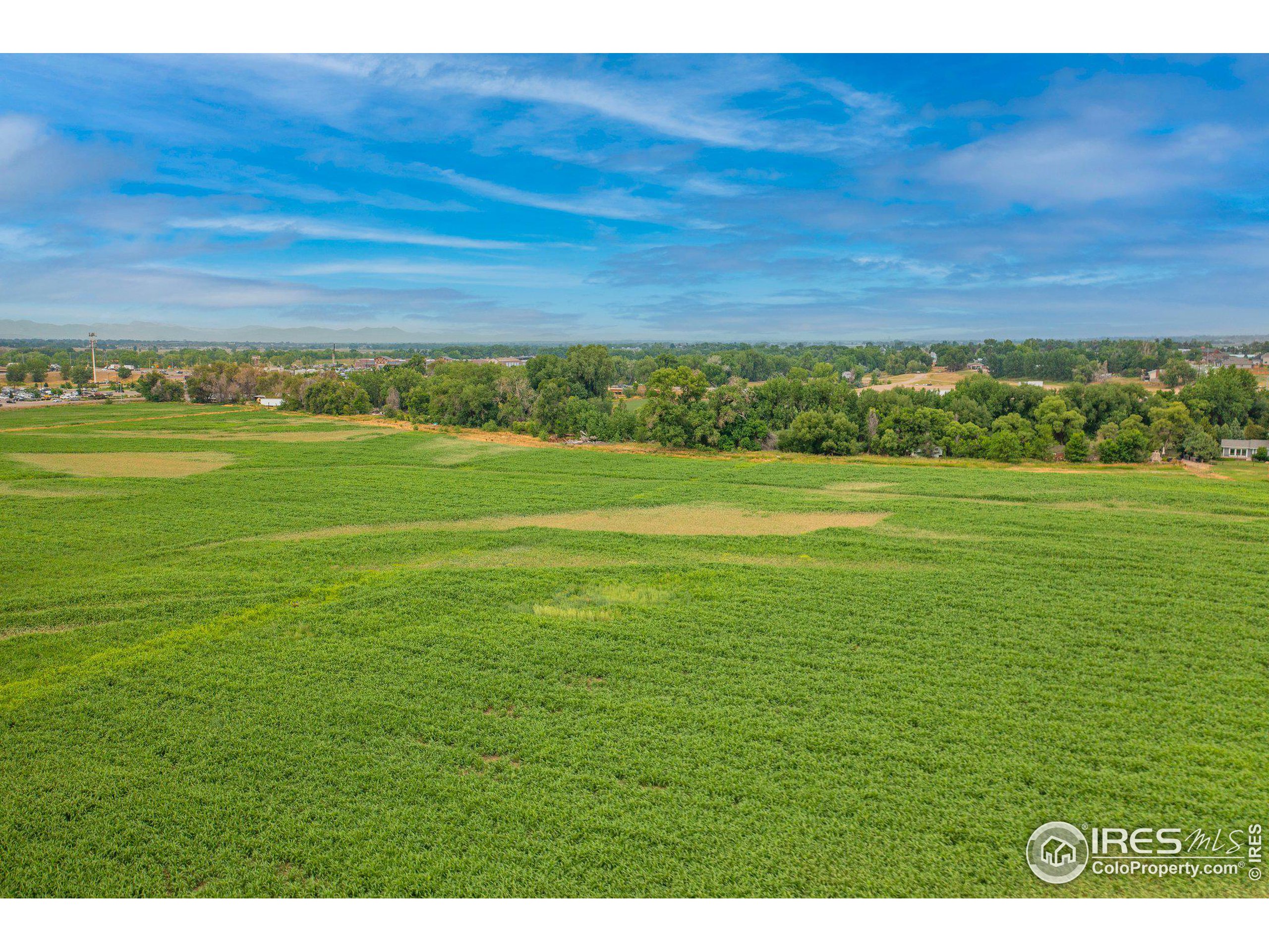 4801 East Harmony Road Fort Collins, CO 80528 - Photo 21 of 27 a view of a big yard with an outdoor space