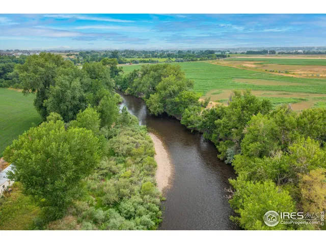 a view of a lake with a yard