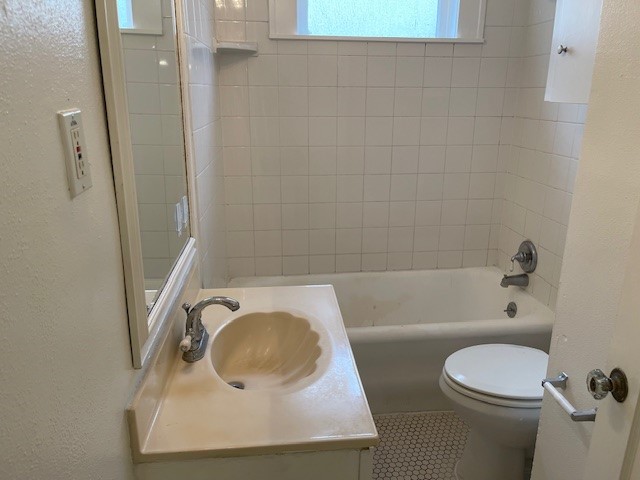 1661 Kipling Street, Unit 2 Houston, TX 77006 - Photo 7 of 10 a bathroom with a sink a toilet and shower
