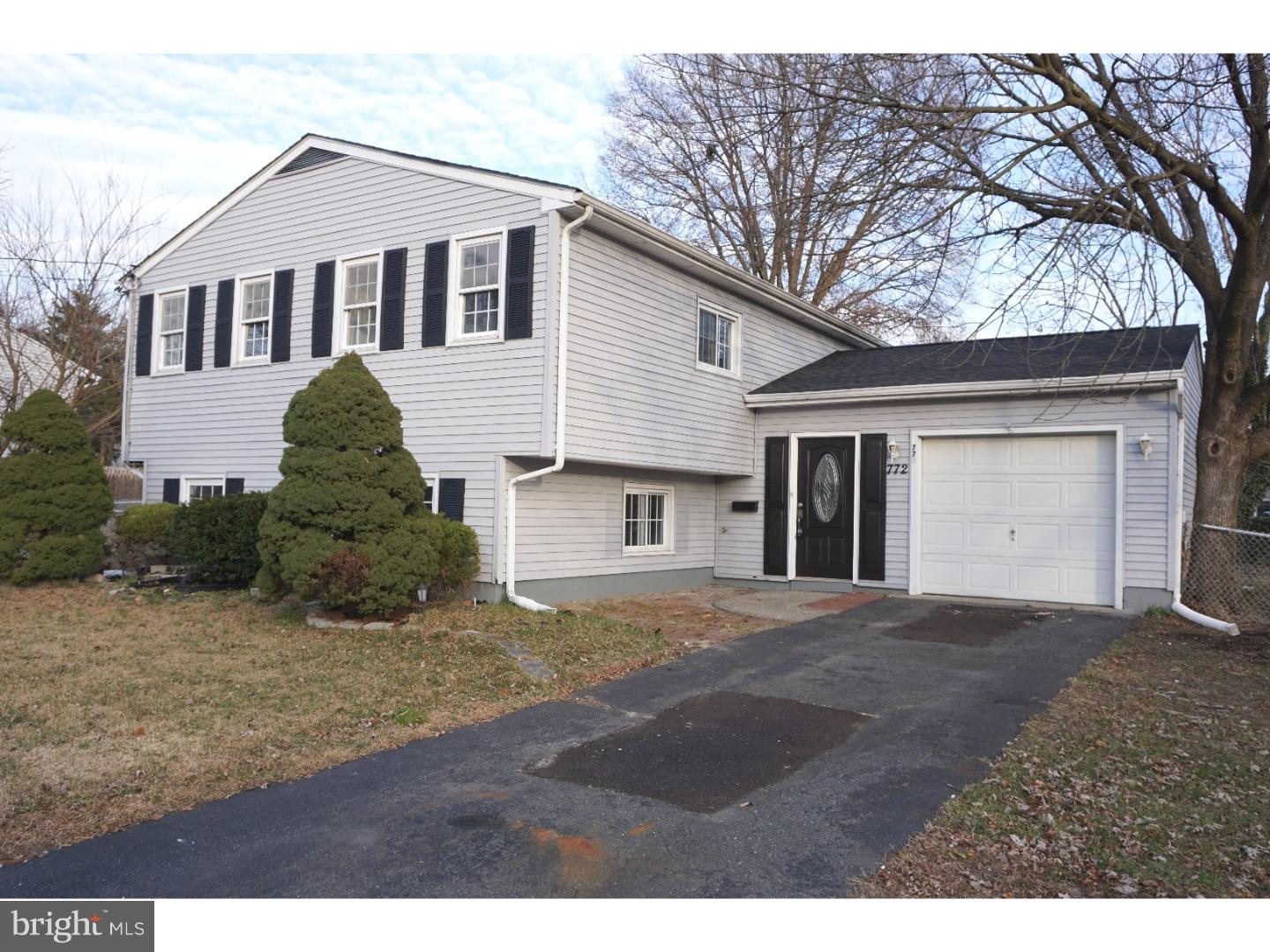 772 Lancing Road Deptford, NJ 08096 - Photo 1 of 24 a front view of a house with a yard and garage