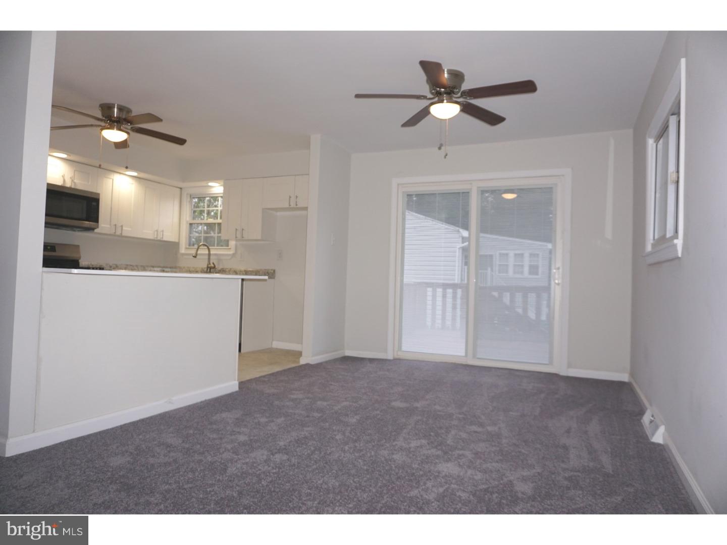 772 Lancing Road Deptford, NJ 08096 - Photo 8 of 24 a view of a livingroom with a ceiling fan and window