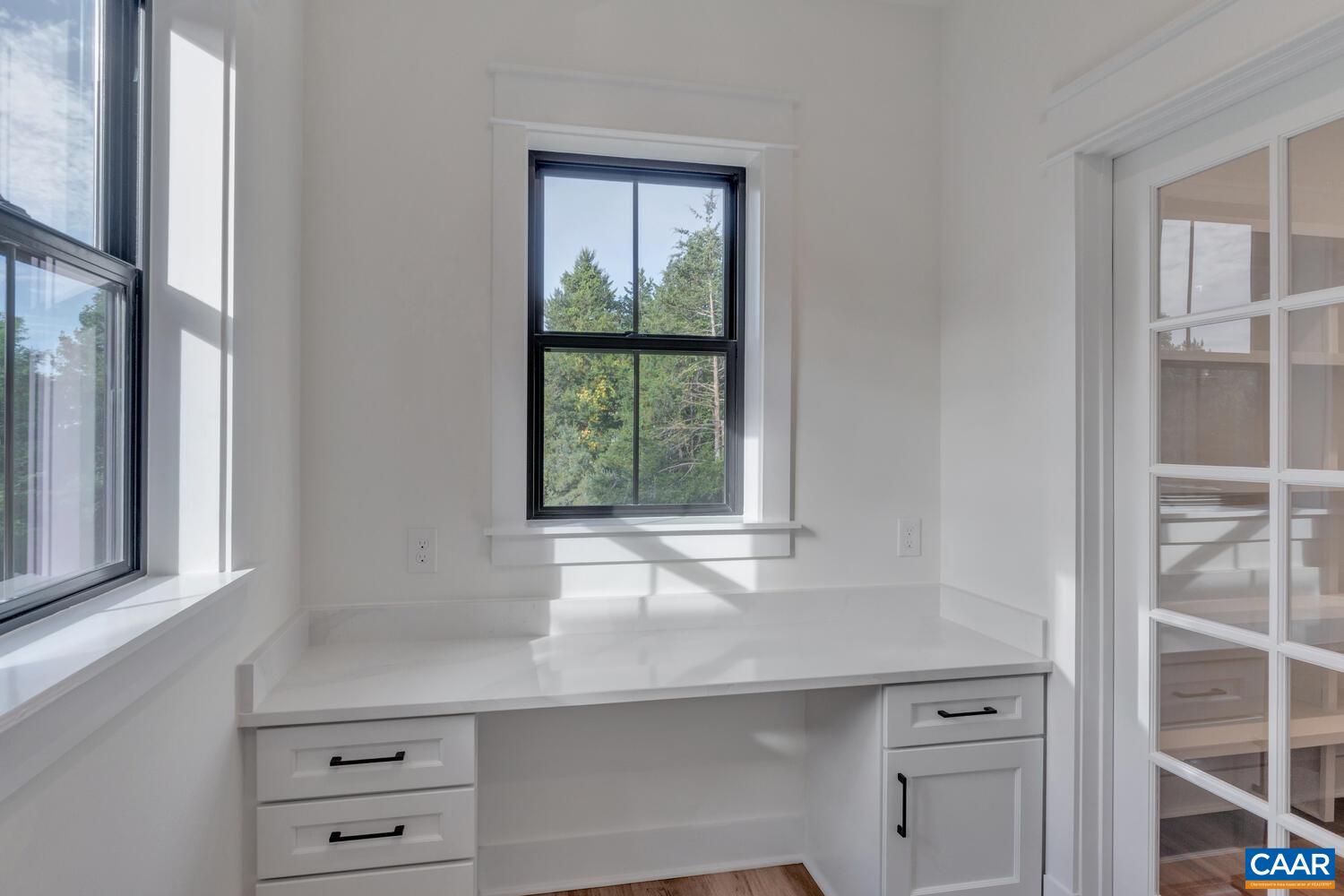 3 B Jarmans Gap Road, Unit LOT 3B JARMANS GAP Crozet, VA 22932 - Photo 18 of 39 a kitchen with a window wooden floor and cabinets