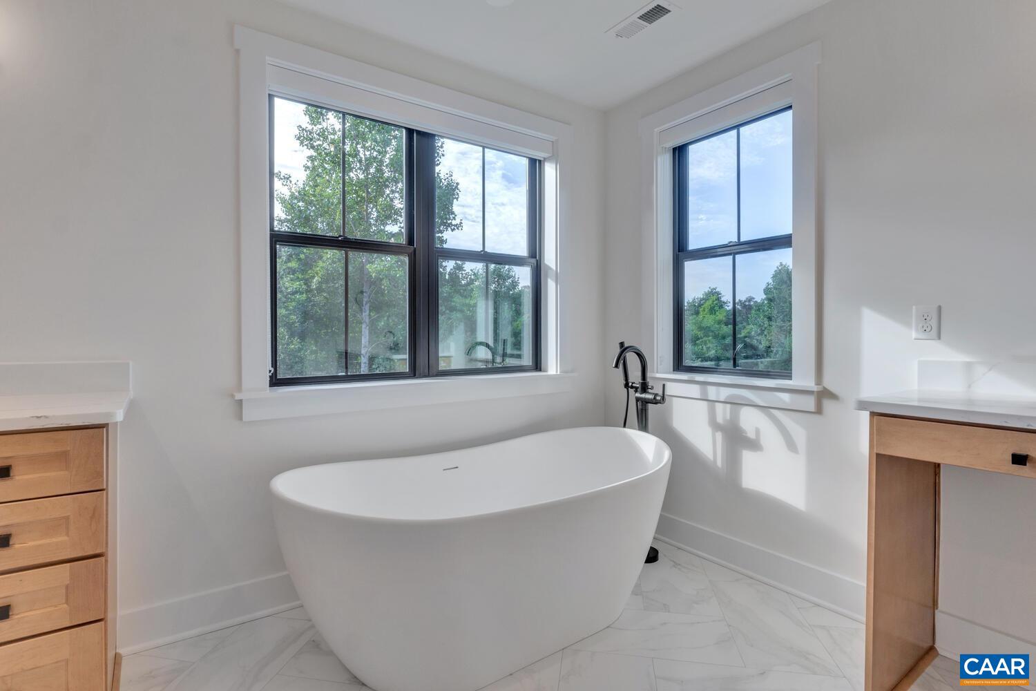 3 B Jarmans Gap Road, Unit LOT 3B JARMANS GAP Crozet, VA 22932 - Photo 37 of 39 a white bath tub sitting in a bathroom next to a window
