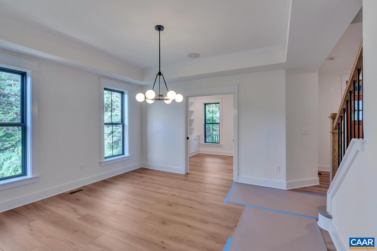3 B Jarmans Gap Road, Unit LOT 3B JARMANS GAP Crozet, VA 22932 - Photo 10 of 39 a view of a room with wooden floor chandelier and windows