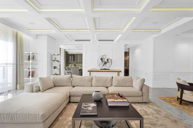 a living room with furniture a rug and a table