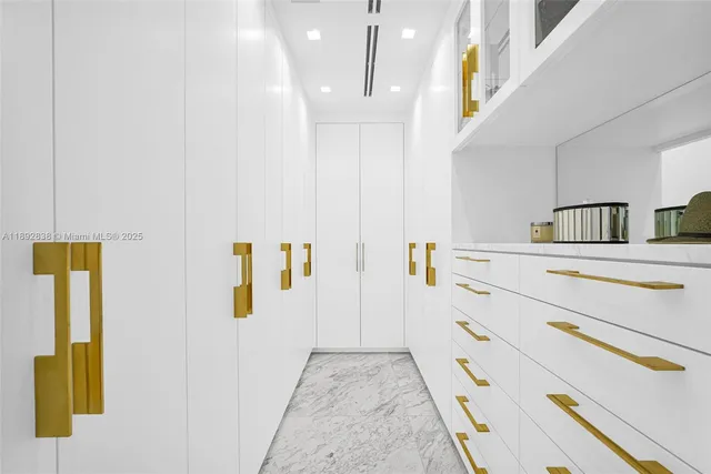 a spacious bedroom with a large bed and a large window