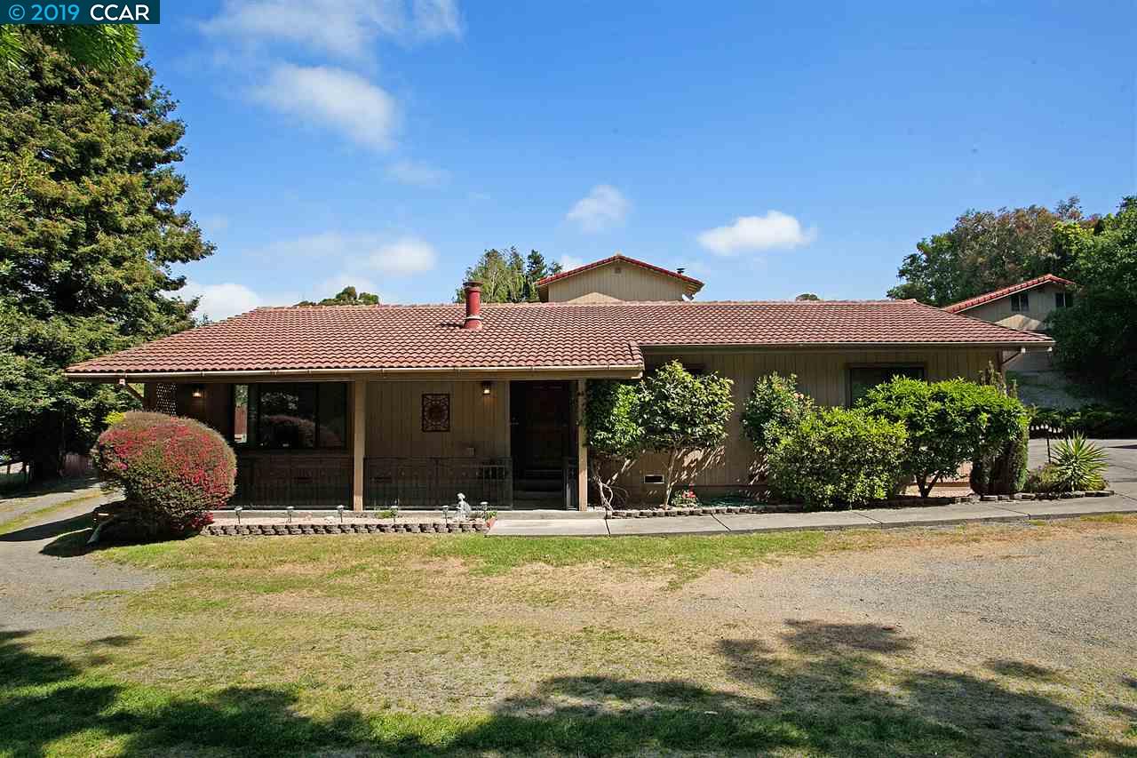 101 North Rancho Place El Sobrante, CA 94803 - Photo 1 of 1 a front view of a house with a garden