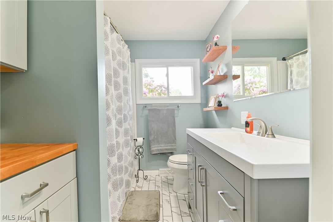 2725 Rockefeller Road Willoughby Hills, OH 44092 - Photo 8 of 21 Bathroom featuring tile flooring, vanity, and toilet