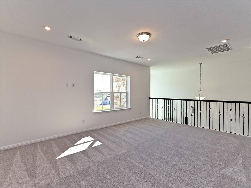 270 Prairie Clover Drive Dripping Springs, TX 78620 - Photo 14 of 28 Carpeted spare room with recessed lighting