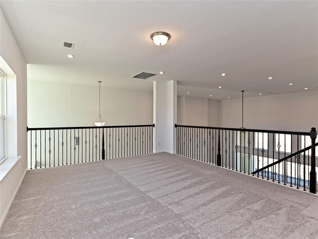 270 Prairie Clover Drive Dripping Springs, TX 78620 - Photo 15 of 28 Carpeted spare room with recessed lighting