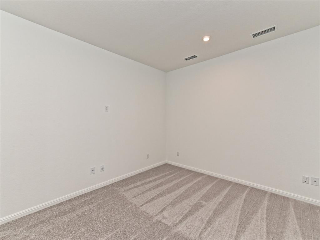 270 Prairie Clover Drive Dripping Springs, TX 78620 - Photo 16 of 28 Unfurnished room featuring light carpet and recessed lighting