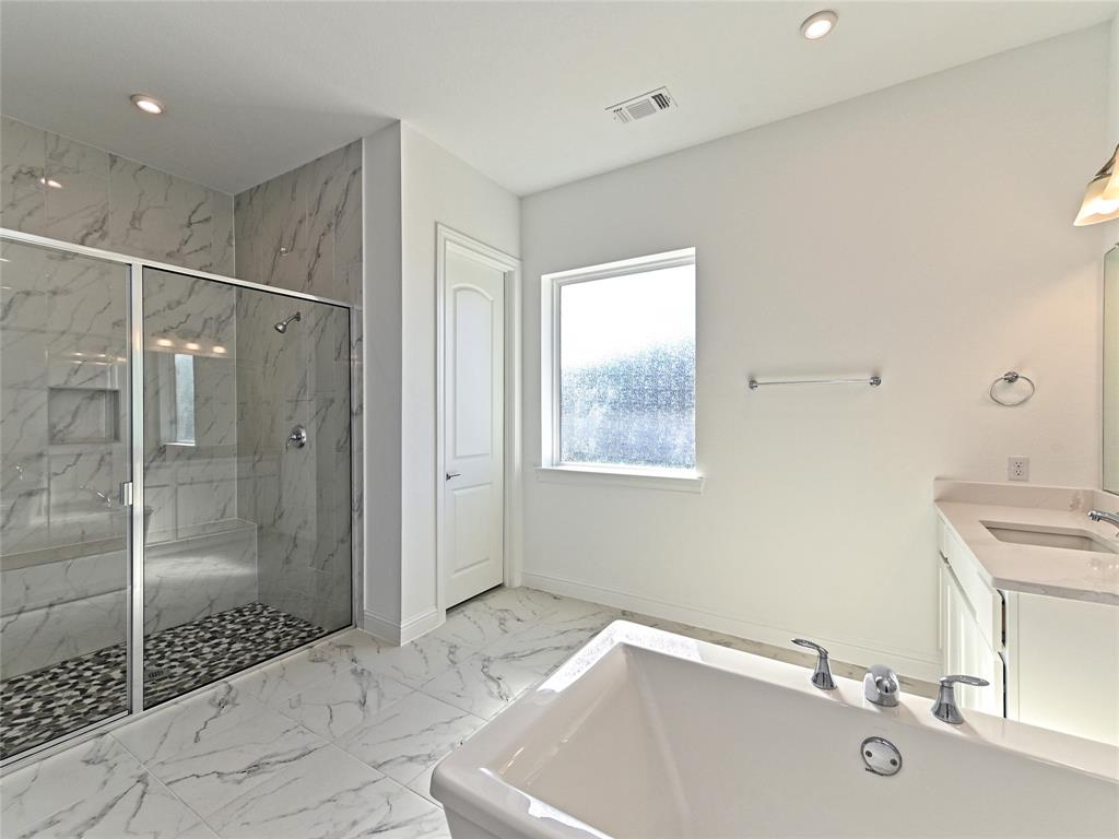 270 Prairie Clover Drive Dripping Springs, TX 78620 - Photo 21 of 28 Bathroom featuring light marble finish flooring, a marble finish shower, vanity, a tub, and recessed lighting