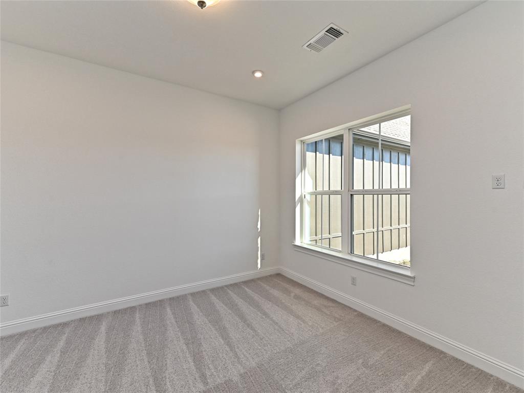 270 Prairie Clover Drive Dripping Springs, TX 78620 - Photo 3 of 28 Spare room with light colored carpet and recessed lighting