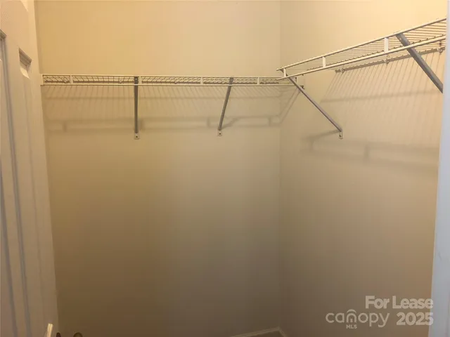 a white toilet sitting next to a white tub