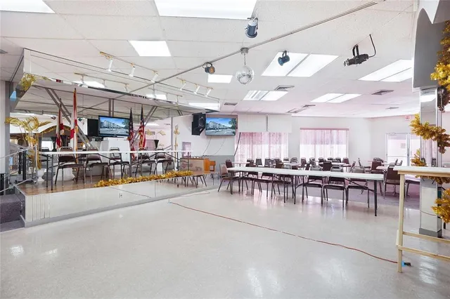 a view of a dining room with lots of tables and chairs
