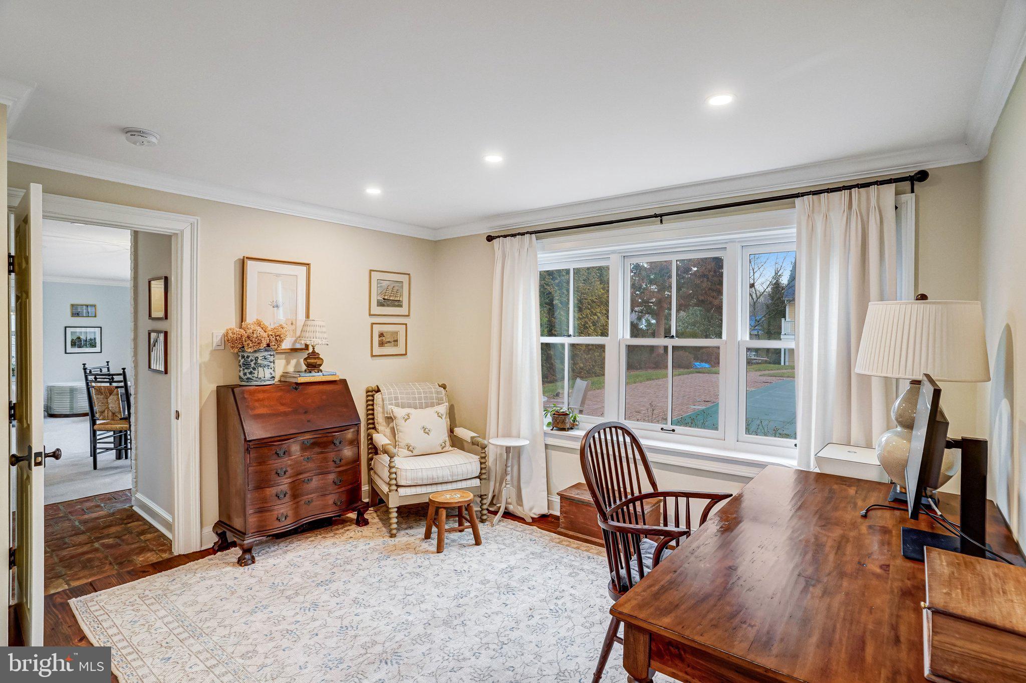 7153 Main Street Clifton, VA 20124 - Photo 12 of 77 a living room with furniture a rug and a large window