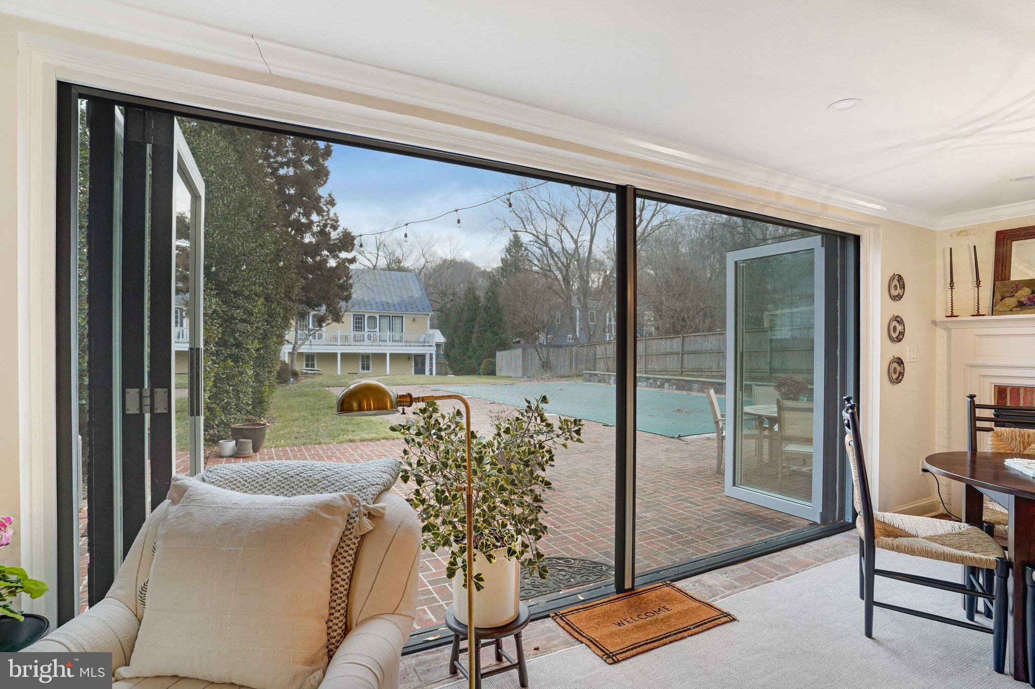 7153 Main Street Clifton, VA 20124 - Photo 14 of 77 a living room with furniture and a floor to ceiling window