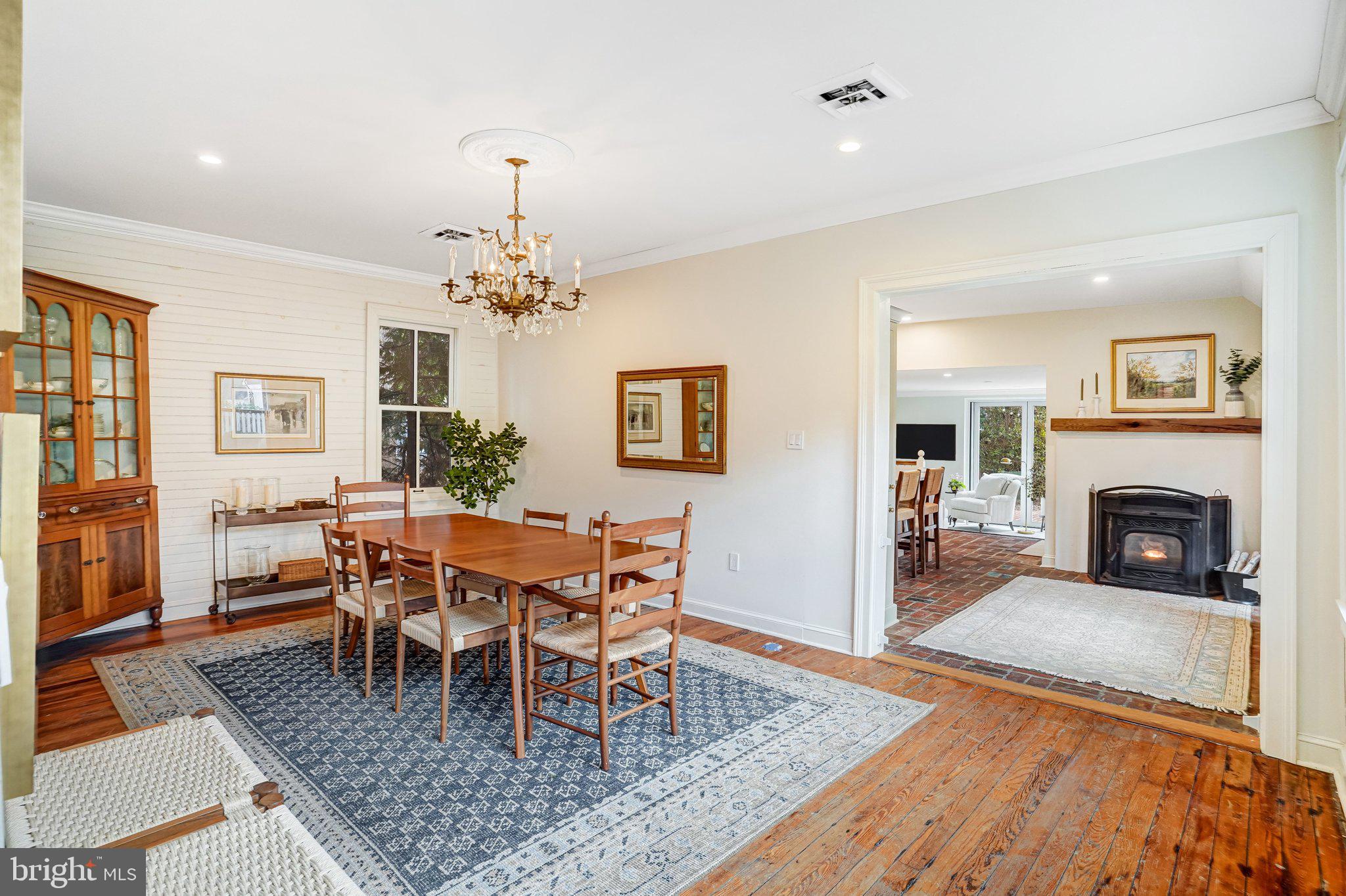 7153 Main Street Clifton, VA 20124 - Photo 29 of 77 a view of a dining room with furniture a rug and wooden floor
