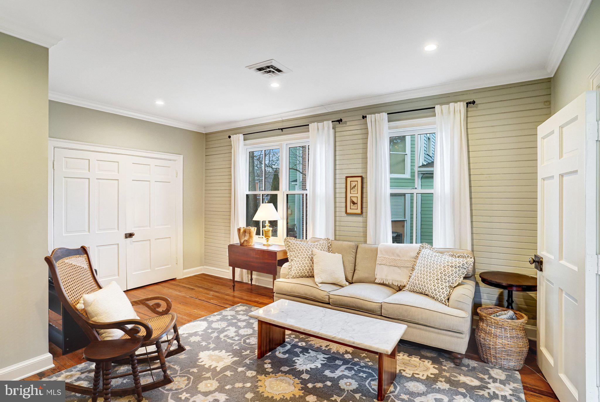 7153 Main Street Clifton, VA 20124 - Photo 33 of 77 a living room with furniture and a window