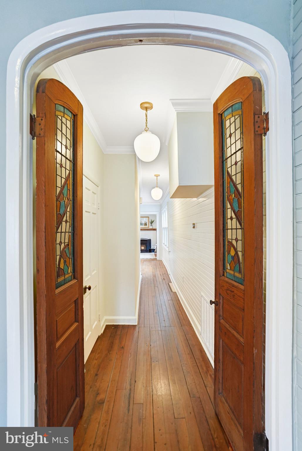 7153 Main Street Clifton, VA 20124 - Photo 35 of 77 a view of a hallway view with wooden floor and staircase