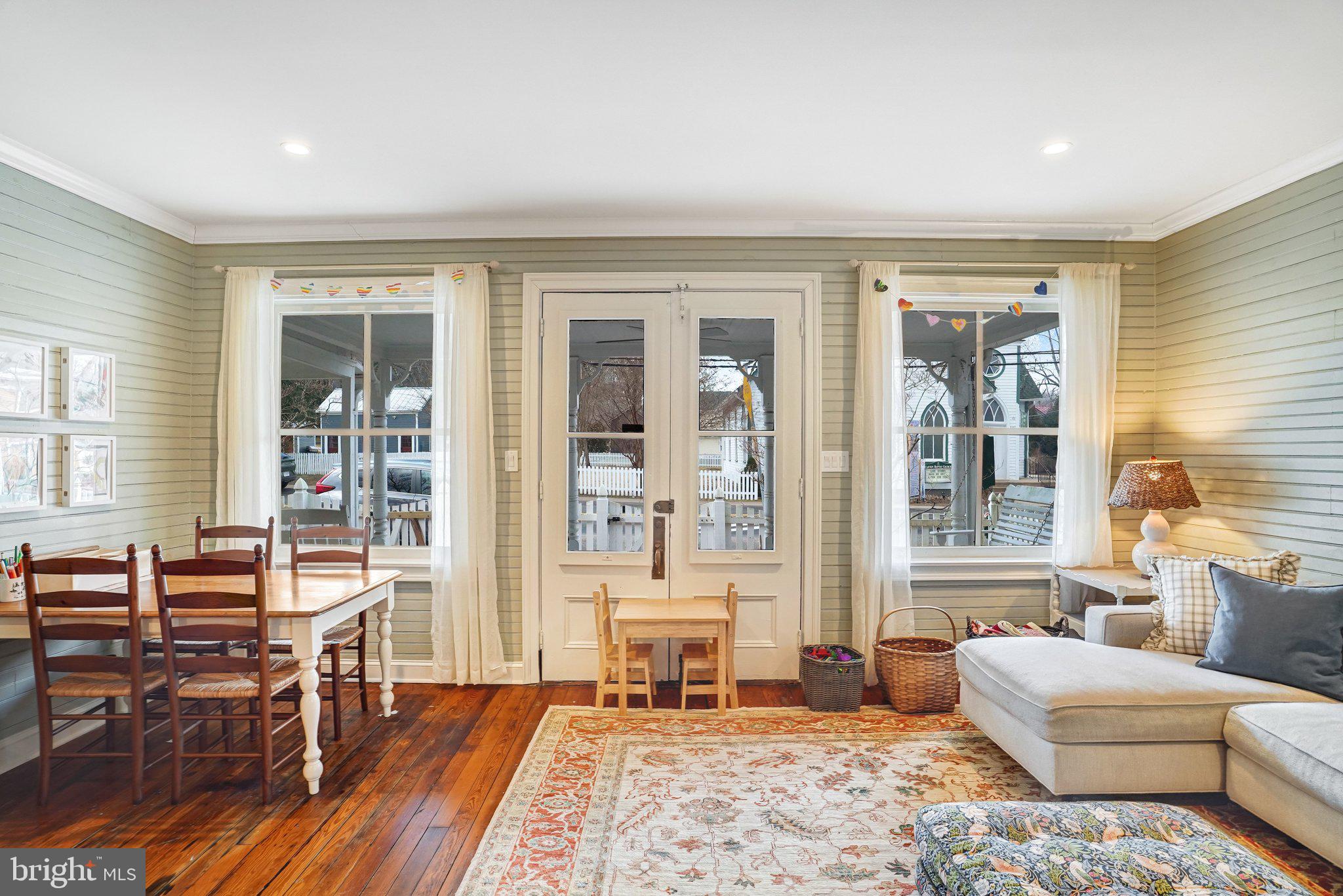7153 Main Street Clifton, VA 20124 - Photo 37 of 77 a living room with furniture and two large window