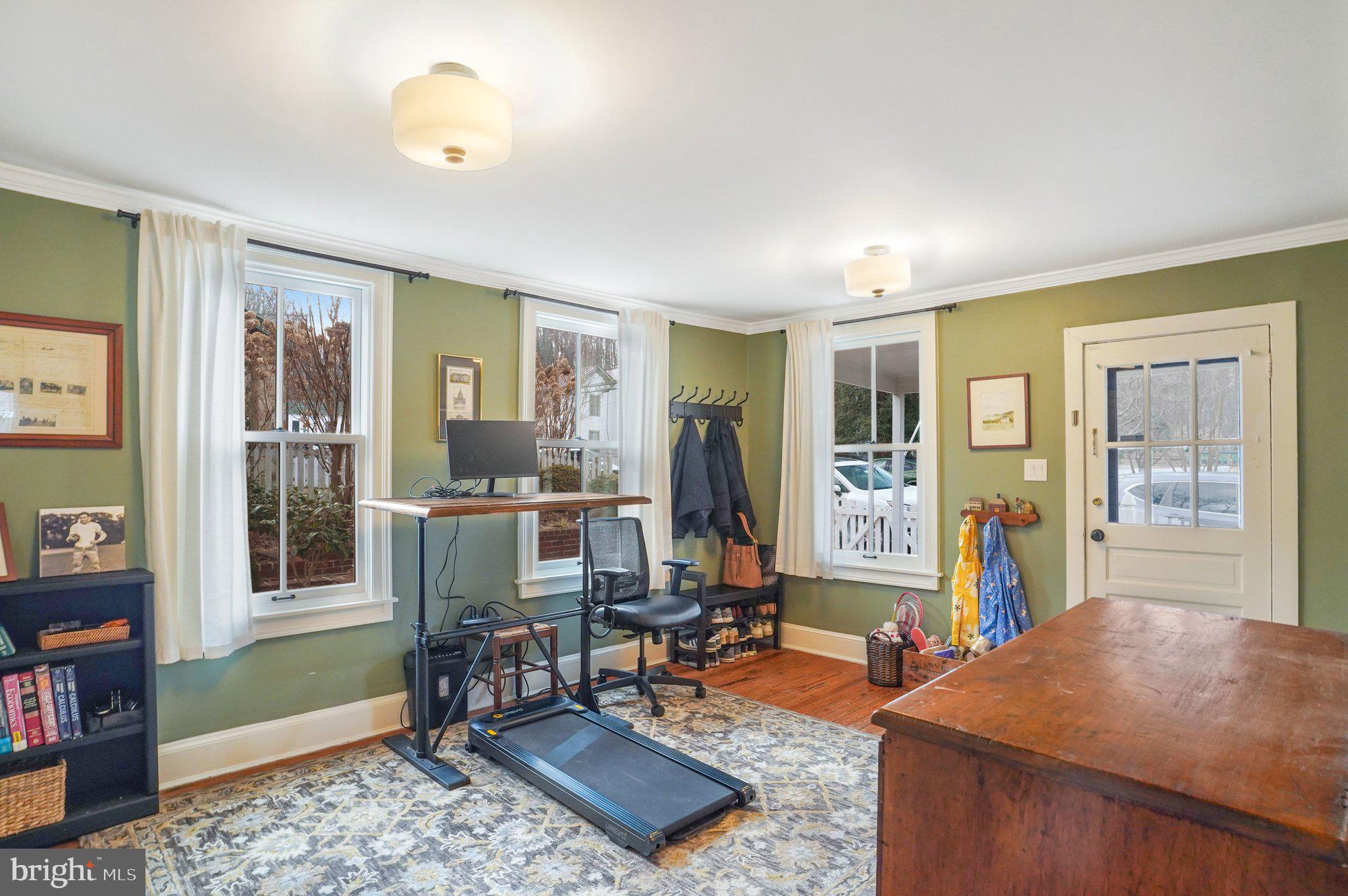 7153 Main Street Clifton, VA 20124 - Photo 40 of 77 a living room with furniture and a book shelf