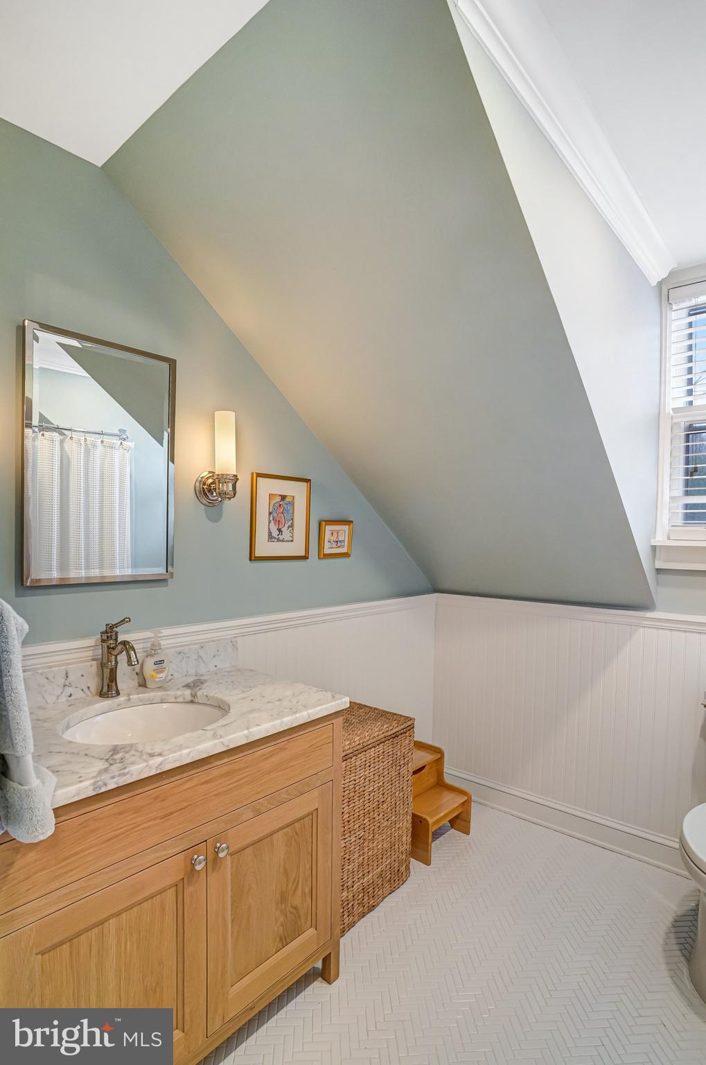 7153 Main Street Clifton, VA 20124 - Photo 52 of 77 a bathroom with a sink and a mirror