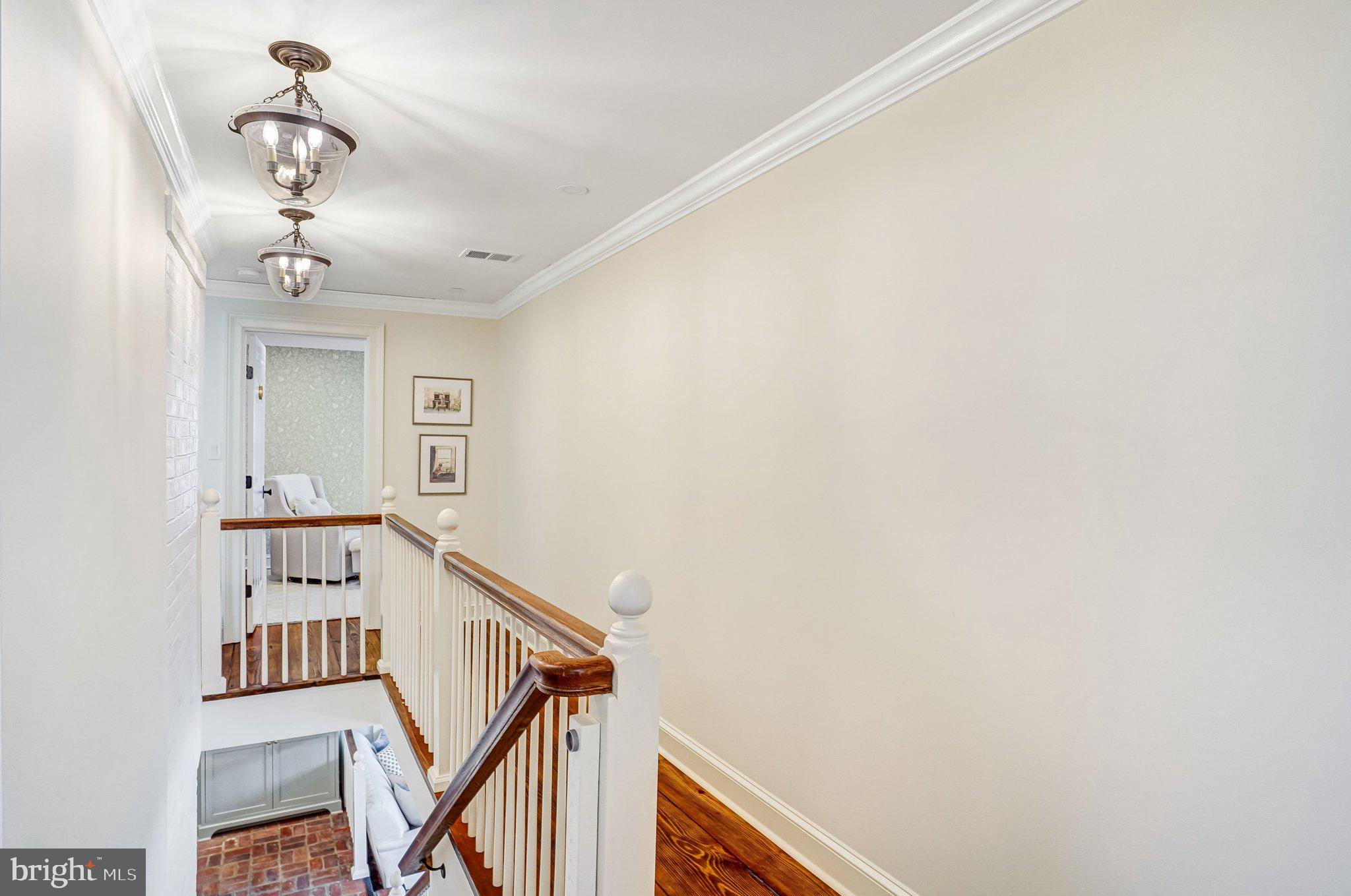 7153 Main Street Clifton, VA 20124 - Photo 54 of 77 a view of a hallway with workspace