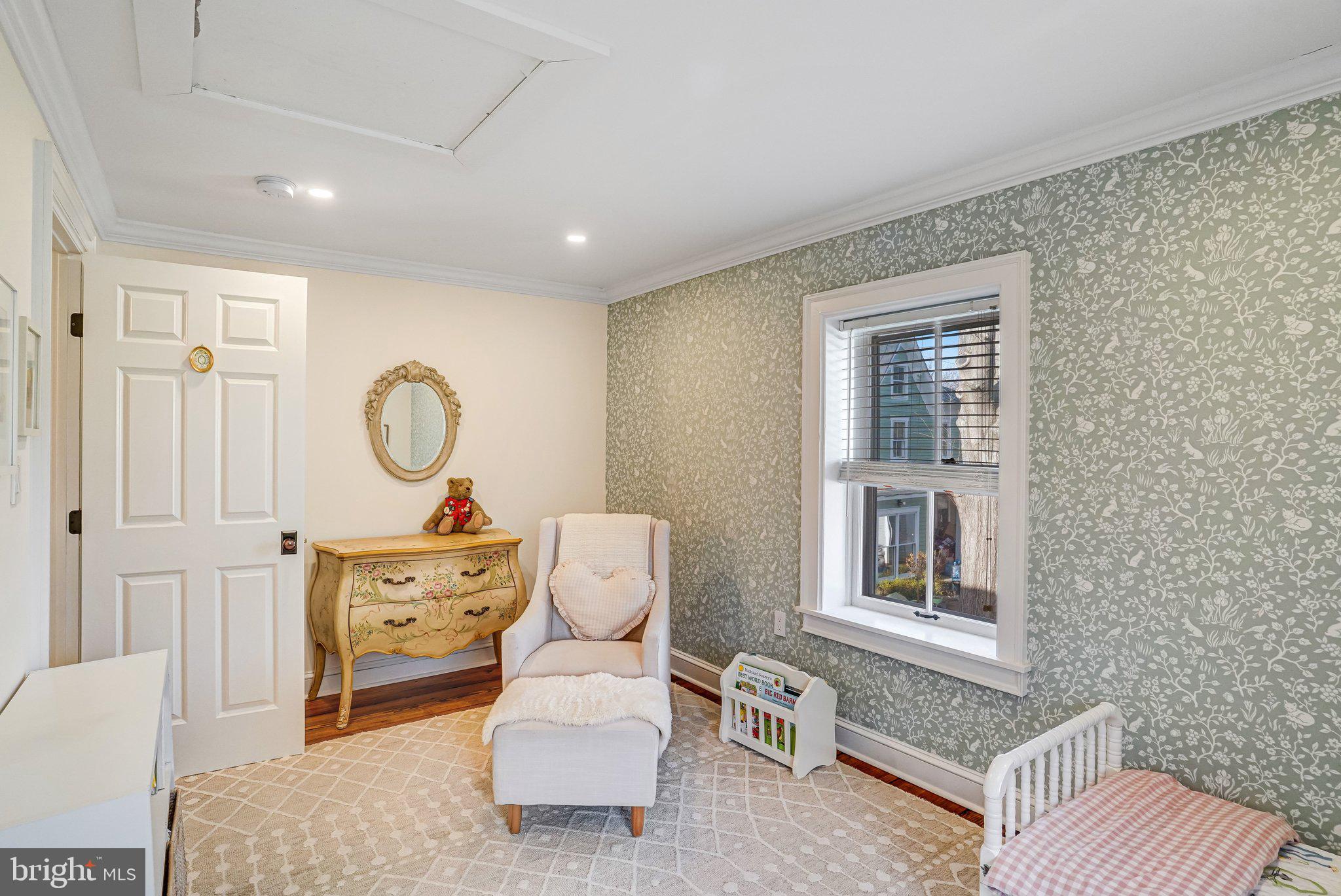 7153 Main Street Clifton, VA 20124 - Photo 56 of 77 a living room with furniture a window and a potted plant