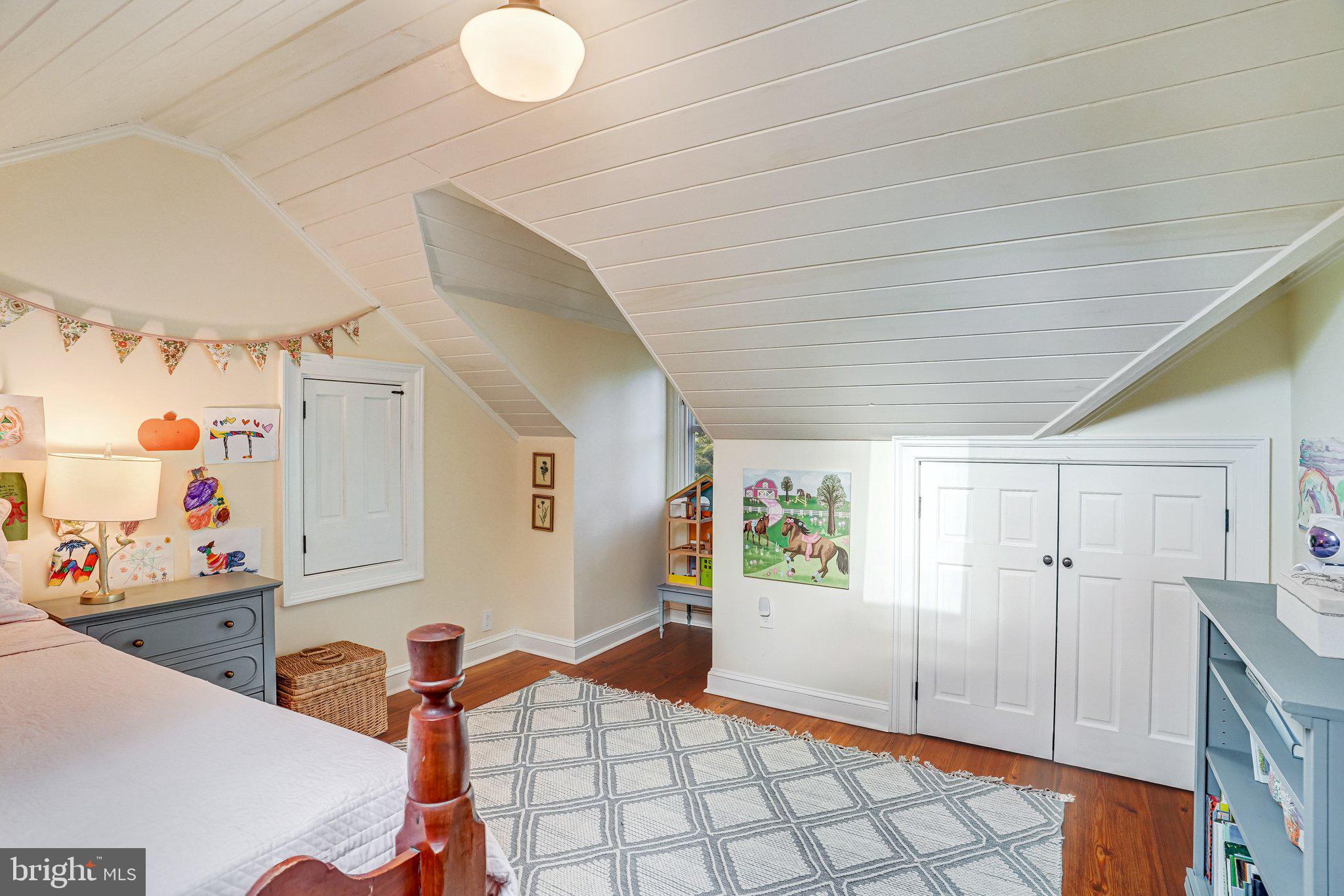7153 Main Street Clifton, VA 20124 - Photo 58 of 77 a bedroom with furniture and natural light