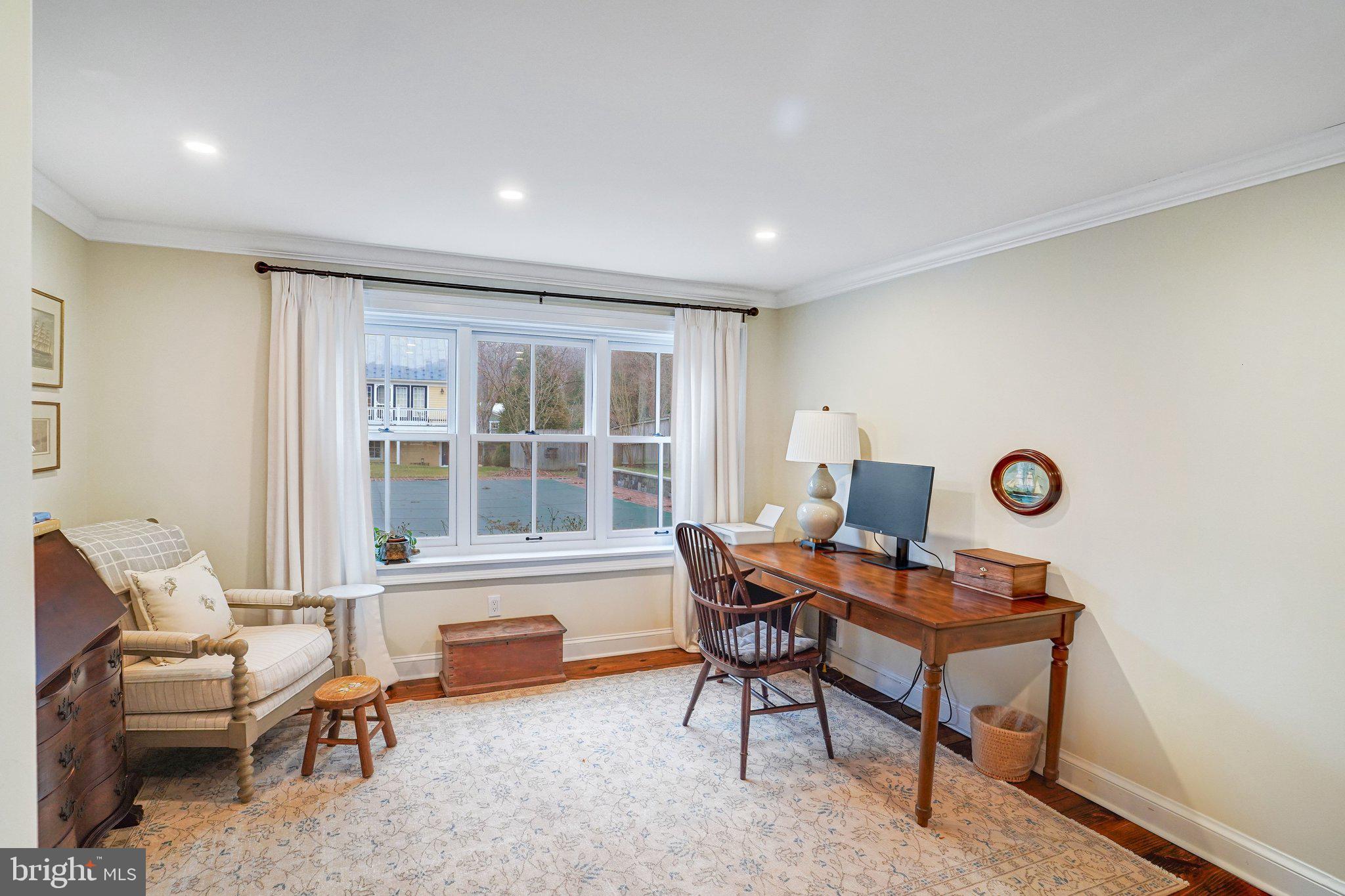 7153 Main Street Clifton, VA 20124 - Photo 10 of 77 a workspace with furniture and a window