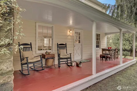 a view of a livingroom with furniture and a table