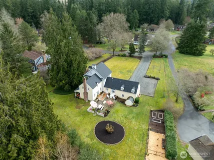 an aerial view of a swimming pool patio yard and outdoor seating