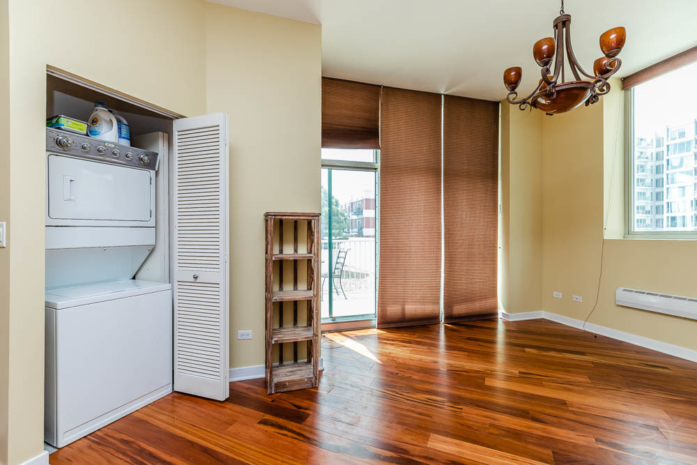 1600 South Indiana Avenue, Unit 501 Chicago, IL 60616 - Photo 12 of 29 a view of a livingroom with wooden floor and window