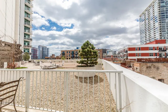 a kitchen with stainless steel appliances a refrigerator sink and microwave