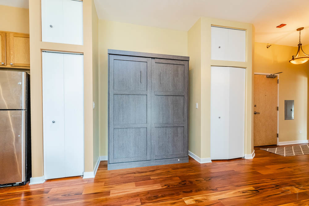 1600 South Indiana Avenue, Unit 501 Chicago, IL 60616 - Photo 21 of 29 a view of a livingroom with wooden floor