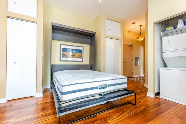 a view of room with window and wooden floor