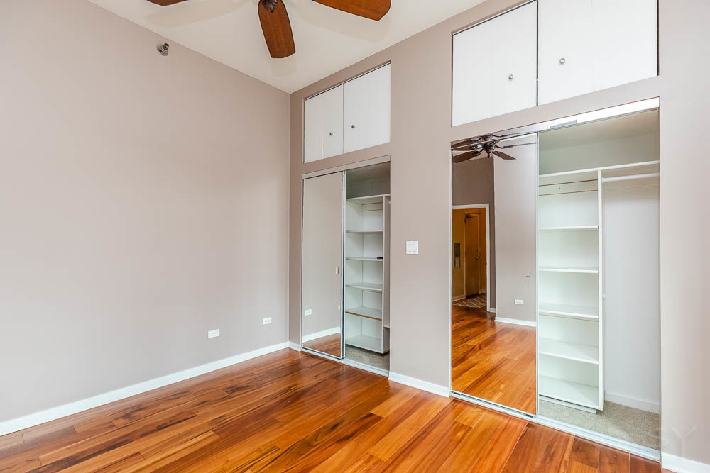 1600 South Indiana Avenue, Unit 501 Chicago, IL 60616 - Photo 26 of 29 a view of room with window and wooden floor