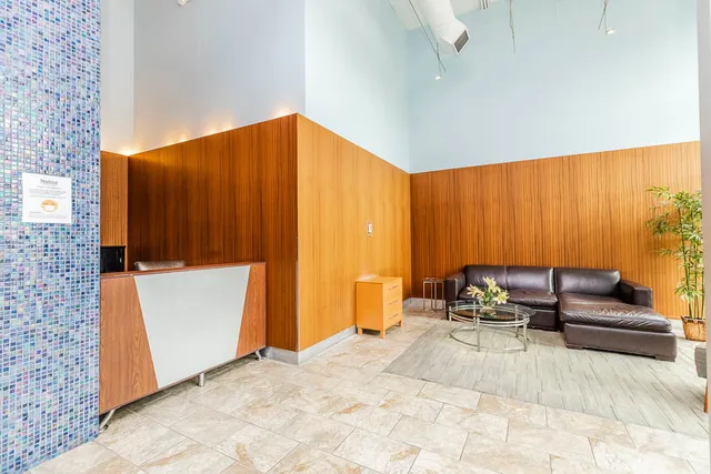 a living room with a couch and a window